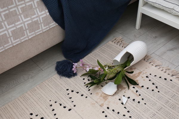 A vase fell on the this carpet or rug. Left on its own, this spill could lead to further water damage in the home's carpets and rugs.